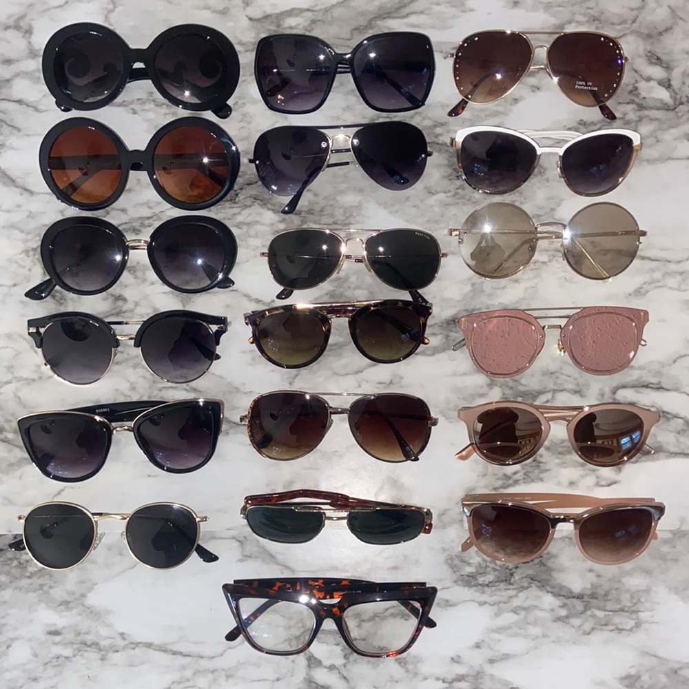 18 pairs of sunglasses and 1 pair of faux glasses